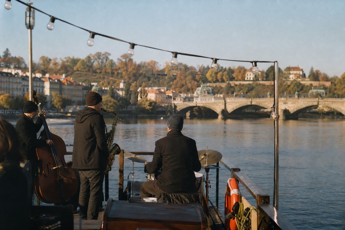 Live jazz players on the deck of an evening cruise boat on the Vltava